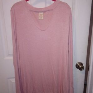 Long sleeve light pink shirt.
